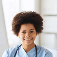 testimonial-happy-female-doctor-or-nurse-writing-to-clipboard